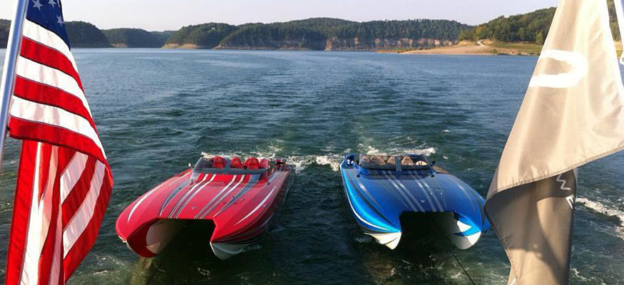 A houseboat tows a pair of Skater Powerboats catamarans along Lake Cumberland in Kentucky. Photo by Fallon Thibodeaux