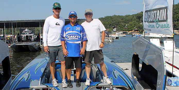 From left: John Tomlinson, Myrick Coil and Mike D'Anniballe stirke a pose on the deck of the Sterling 1700-powered Skater cat after a successful day at the Shootout.