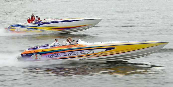 A pair of Cigarette Racing V-bottoms cruise along Lake of the Ozarks during the Support Our Troops Poker Run.