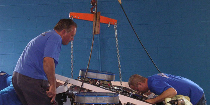 In addition to marine engine building, Frank McComas (left) and Mark Pritula offer complete rigging services.